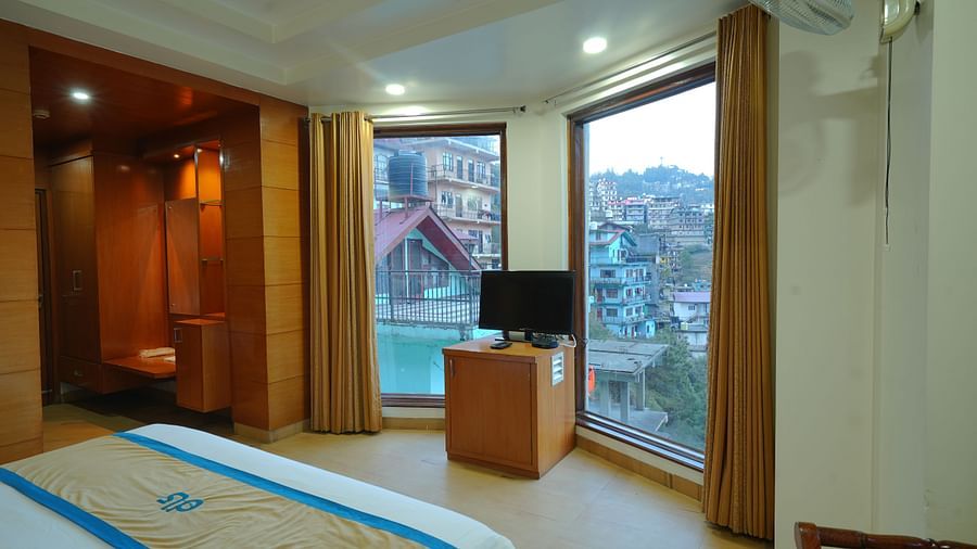 Room with a television on the table at DLS Hotels The Rock Castle.